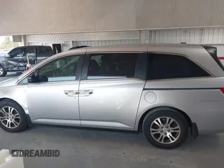 2012 Honda Odyssey EX-L with VIN 5FNRL5H67CB005013, listed as a IAAI auction lot 42295586 with 200,611 mi miles and . Bid and sale history available at DreamBid. Image 14.