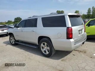 2020 Chevrolet Suburban Premier z VIN 1GNSKJKC0LR164243, wystawiony jako Copart lot #70530624 z przebiegiem Nie podano mil oraz Szkoda całkowita • Salvage title. Historia ofert i sprzedaży dostępna na DreamBid. Obrazek 2.