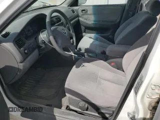 2000 Mazda 626 LX z VIN 1YVGF22C3Y5165341, wystawiony jako Copart lot #56575075 z przebiegiem 58 645 mil mil oraz Szkody całkowita. Historia ofert i sprzedaży dostępna na DreamBid. Obrazek 7.