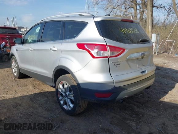 2015 Ford Escape Titanium z VIN 1FMCU0J91FUC41531, wystawiony jako IAAI lot #41903203 z przebiegiem 118 962 mil mil oraz . Historia ofert i sprzedaży dostępna na DreamBid. Obrazek 3.