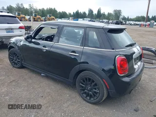 2015 MINI Hardtop 4 Door with VIN WMWXS5C58FT833420, listed as a IAAI auction lot 42560244 with 115,446 mi miles and . Bid and sale history available at DreamBid. Image 3.