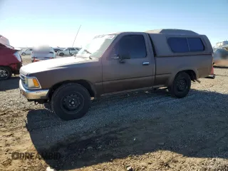 1989 Toyota Pickup DX z VIN JT4RN81P2K0027609, wystawiony jako Copart lot #79361344 z przebiegiem 225 997 mil mil oraz Czysty tytuł • Clean title. Historia ofert i sprzedaży dostępna na DreamBid. Obrazek 1.