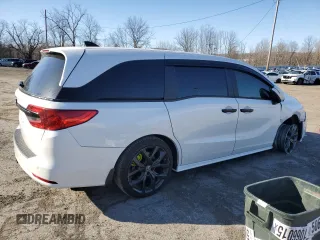 2021 Honda Odyssey EX-L with VIN 5FNRL6H78MB019258, listed as a Copart auction lot 52496285 with 33,734 mi miles and Salvage Title. Bid and sale history available at DreamBid. Image 3.