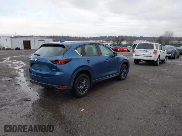 2019 Mazda CX-5 Sport with VIN JM3KFBBM5K0668678, listed as a IAAI auction lot 41811146 with 102,634 mi miles and . Bid and sale history available at DreamBid. Image 4.