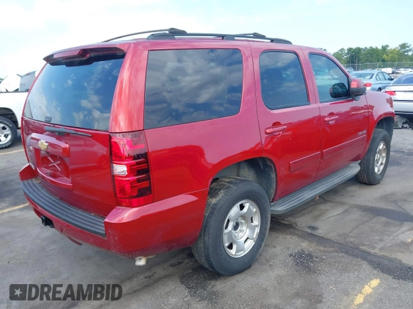 2013 Chevrolet Tahoe LS with VIN 1GNSCAE00DR359498, listed as a IAAI auction lot 40125477 with 156,100 mi miles and . Bid and sale history available at DreamBid. Image 4.