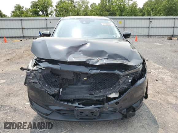 2019 Mazda CX-5 Grand Touring with VIN JM3KFBDM2K0569829, listed as a Copart auction lot 59060965 with 99,359 mi miles and Salvage title. Bid and sale history available at DreamBid. Image 5.