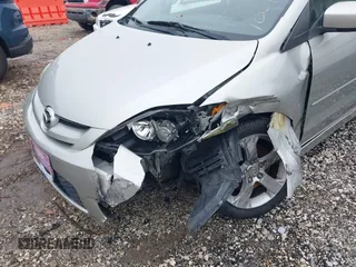 2007 Mazda 5 Touring with VIN JM1CR29L570139627, listed as a IAAI auction lot 41153270 with 90,228 mi miles and . Bid and sale history available at carsss.com. Image 6.
