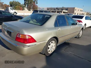 1999 Acura RL with VIN JH4KA9661XC005883, listed as a IAAI auction lot 40560595 with 165,195 mi miles. Bid and sale history available at carsss.com. Image 4.