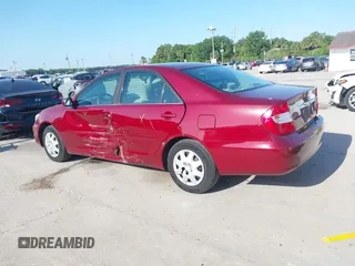 2004 Toyota Camry LE with VIN 4T1BE32KX4U272768, listed as a IAAI auction lot 42006421 with 204,386 mi miles. Bid and sale history available at carsss.com. Image 14.