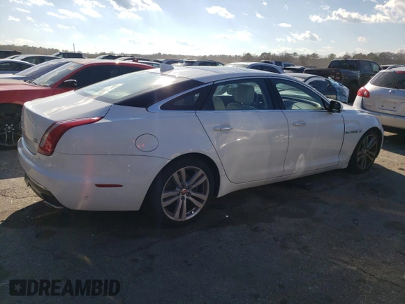 2017 Jaguar XJ with VIN SAJWJ2GD4H8W12163, listed as a Copart auction lot 86993064 with 63,697 mi miles and Salvage Title. Bid and sale history available at carsss.com. Image 3.