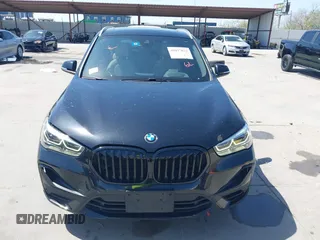 2021 BMW X1 sDrive28i with VIN WBXJG7C07M3M65841, listed as a IAAI auction lot 41877032 with 79,817 mi miles and . Bid and sale history available at DreamBid. Image 12.