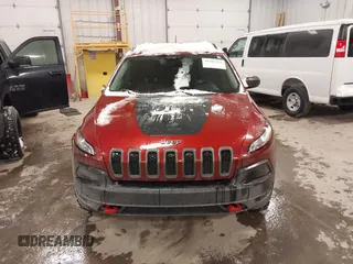 2015 Jeep Cherokee Trailhawk with VIN 1C4PJMBS2FW609999, listed as a IAAI auction lot 41582536 with 133,666 mi miles. Bid and sale history available at carsss.com. Image 12.