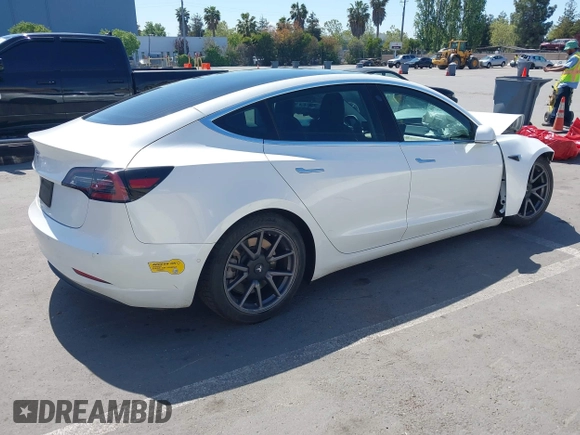2020 Tesla Model 3 Standard Range Plus with VIN 5YJ3E1EAXLF590591, listed as a IAAI auction lot 42140338 with 79,342 mi miles and . Bid and sale history available at DreamBid. Image 4.
