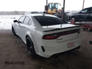 2023 Dodge Charger Scat Pack Widebody with VIN 2C3CDXGJ9PH516473, listed as a IAAI auction lot 41188167 with 38,021 mi miles and . Bid and sale history available at DreamBid. Image 3.