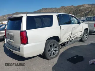2015 Chevrolet Suburban LT with VIN 1GNSCJKC9FR295169, listed as a IAAI auction lot 42374760 with Not provided miles and . Bid and sale history available at DreamBid. Image 4.