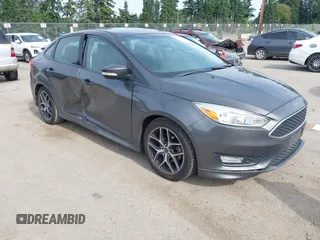 2015 Ford Focus SE z VIN 1FADP3F20FL269846, wystawiony jako IAAI lot #42507197 z przebiegiem 143 496 mil mil oraz . Historia ofert i sprzedaży dostępna na DreamBid. Obrazek 1.