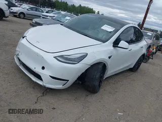 2021 Tesla Model Y Standard Range with VIN 5YJYGDED9MF121828, listed as a IAAI auction lot 42119518 with 34,454 mi miles and . Bid and sale history available at carsss.com. Image 18.