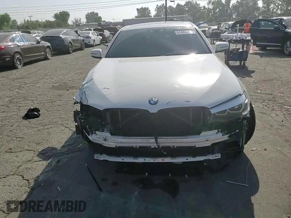 2020 BMW 5 Series 540i z VIN WBAJS1C01LCD37859, wystawiony jako Copart lot #61483155 z przebiegiem 49 087 mil mil oraz Szkoda całkowita • Salvage title. Historia ofert i sprzedaży dostępna na DreamBid. Obrazek 14.