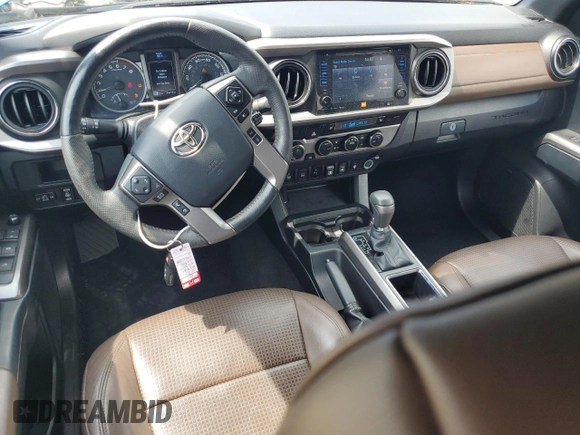 2018 Toyota Tacoma SR z VIN 3TMGZ5AN5JM148719, wystawiony jako Copart lot #56621065 z przebiegiem 34 433 mil mil oraz Szkoda całkowita • Salvage title. Historia ofert i sprzedaży dostępna na DreamBid. Obrazek 8.