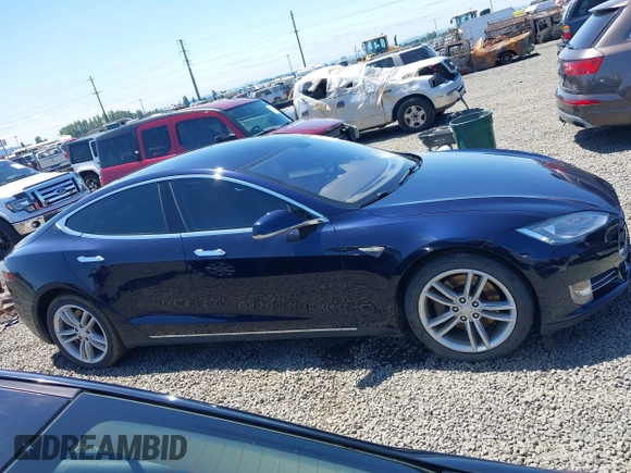 2014 Tesla Model S 60 with VIN 5YJSA1H18EFP31969, listed as a IAAI auction lot 42312485 with 90,043 mi miles and . Bid and sale history available at DreamBid. Image 14.