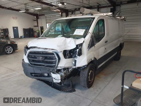 2020 Ford Transit Cargo with VIN 1FTBR1Y81LKA19650, listed as a IAAI auction lot 42727232 with 103,676 mi miles and . Bid and sale history available at DreamBid. Image 17.