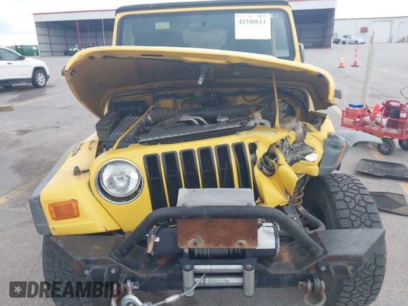 2005 Jeep Wrangler SE z VIN 1J4FA29S95P373313, wystawiony jako IAAI lot #42340611 z przebiegiem 162 801 mil mil oraz . Historia ofert i sprzedaży dostępna na DreamBid. Obrazek 6.