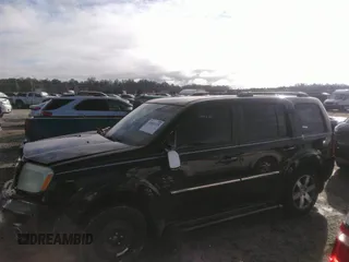 2012 Honda Pilot Touring with VIN 5FNYF3H90CB035309, listed as a IAAI auction lot 41063215 with 228,081 mi miles and . Bid and sale history available at carsss.com. Image 14.