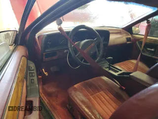 1991 Mercury Cougar z VIN 1MEPM60T4MH652996, wystawiony jako Copart lot #43811635 z przebiegiem 129 452 mil mil oraz Nie do naprawy • Non repairable. Historia ofert i sprzedaży dostępna na DreamBid. Obrazek 8.