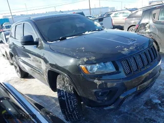 2015 Jeep Grand Cherokee Altitude with VIN 1C4RJFAG6FC724592, listed as a IAAI auction lot 41525448 with 173,306 mi miles. Bid and sale history available at carsss.com. Image 1.