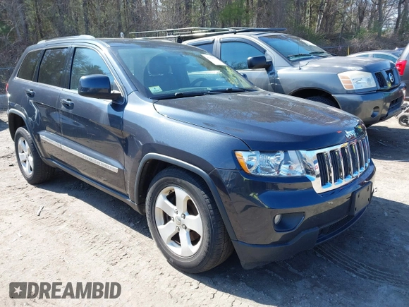 2013 Jeep Grand Cherokee Laredo with VIN 1C4RJFAG1DC592371, listed as a IAAI auction lot 42064993 with 136,154 mi miles. Bid and sale history available at carsss.com. Image 1.