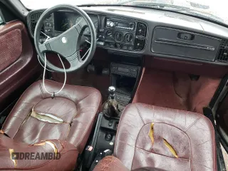 1988 Saab 900 z VIN YS3AT75L0J7015445, wystawiony jako Copart lot #77775074 z przebiegiem 225 073 mil mil oraz Szkoda całkowita • Salvage title. Historia ofert i sprzedaży dostępna na DreamBid. Obrazek 8.