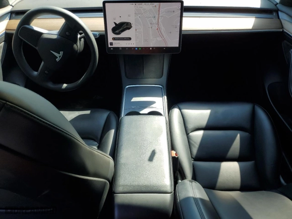 2021 Tesla Model 3 Standard Range Plus with VIN 5YJ3E1EAXMF069467, listed as a Copart auction lot 63273134 with 66,393 mi miles and Salvage Title. Bid and sale history available at carsss.com. Image 8.