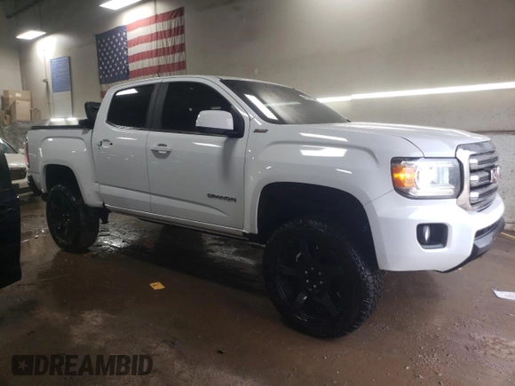 2015 GMC Canyon 4WD SLE with VIN 1GTG6BE36F1187064, listed as a Copart auction lot 46594735 with 109,987 mi miles and Salvage Title. Bid and sale history available at carsss.com. Image 4.