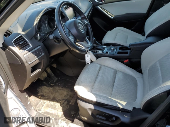 2016 Mazda CX-5 Grand Touring with VIN JM3KE4DY0G0727366, listed as a Copart auction lot 51682115 with 114,462 mi miles and Salvage Title. Bid and sale history available at carsss.com. Image 7.