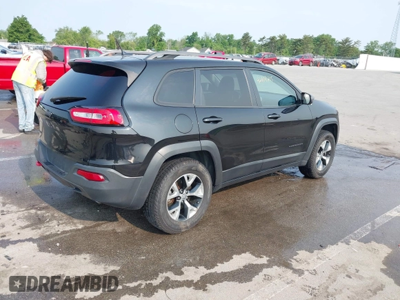 2015 Jeep Cherokee Trailhawk with VIN 1C4PJMBS6FW786622, listed as a IAAI auction lot 42403215 with 148,205 mi miles and . Bid and sale history available at DreamBid. Image 4.