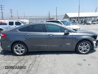 2016 Ford Fusion Titanium with VIN 3FA6P0SU1GR304590, listed as a IAAI auction lot 42381545 with 136,684 mi miles and . Bid and sale history available at DreamBid. Image 14.