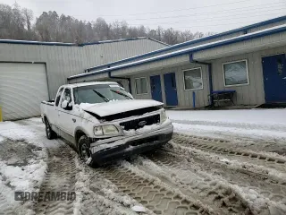 1999 Ford F-250 with VIN 1FTRX27L9XKA27324, listed as a Copart auction lot 87019484 with 152,787 mi miles and Salvage title. Bid and sale history available at DreamBid. Image 11.