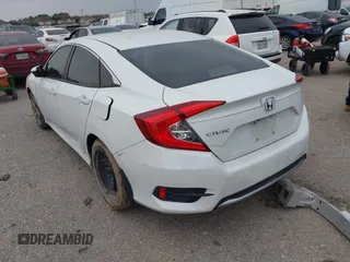 2020 Honda Civic LX with VIN 19XFC2F62LE021811, listed as a IAAI auction lot 41591466 with 75,797 mi miles and . Bid and sale history available at DreamBid. Image 3.