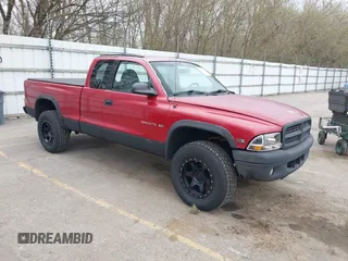 1999 Dodge Dakota SLT z VIN 1B7GG22Y1XS260429, wystawiony jako IAAI lot #42082171 z przebiegiem 214 037 mil mil oraz . Historia ofert i sprzedaży dostępna na DreamBid. Obrazek 1.