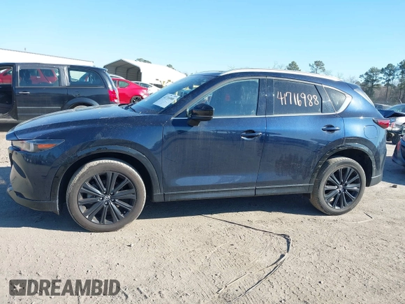 2022 Mazda CX-5 2.5 Turbo with VIN JM3KFBAY4N0534690, listed as a IAAI auction lot 41716988 with 23,910 mi miles and . Bid and sale history available at carsss.com. Image 14.