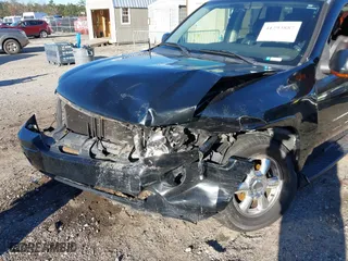 2005 GMC Envoy SLE with VIN 1GKDS13S152246568, listed as a IAAI auction lot 41293887 with 315,882 mi miles. Bid and sale history available at carsss.com. Image 6.