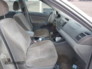 2004 Toyota Camry LE with VIN JTDBE32K640257695, listed as a IAAI auction lot 41837872 with 214,917 mi miles. Bid and sale history available at carsss.com. Image 5.