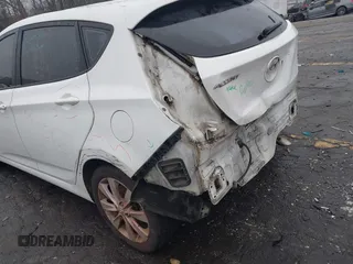 2014 Hyundai Accent SE with VIN KMHCU5AE8EU145629, listed as a IAAI auction lot 41497848 with 134,919 mi miles. Bid and sale history available at carsss.com. Image 13.
