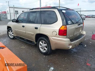 2005 GMC Envoy SLT with VIN 1GKDS13S452141376, listed as a IAAI auction lot 42095025 with 198,911 mi miles and . Bid and sale history available at DreamBid. Image 3.