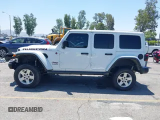 2018 Jeep Wrangler Unlimited Rubicon with VIN 1C4HJXFN8JW215023, listed as a IAAI auction lot 42227099 with 62,195 mi miles and . Bid and sale history available at DreamBid. Image 14.