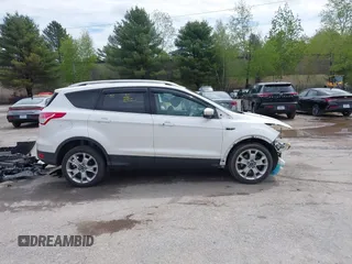 2016 Ford Escape Titanium with VIN 1FMCU9J98GUA00832, listed as a IAAI auction lot 42188941 with 90,764 mi miles and . Bid and sale history available at DreamBid. Image 13.