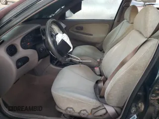 2000 Hyundai Elantra GLS z VIN KMHJF35F6YU890800, wystawiony jako Copart lot #76972294 z przebiegiem 159 134 mil mil oraz Szkoda całkowita • Salvage title. Historia ofert i sprzedaży dostępna na DreamBid. Obrazek 7.