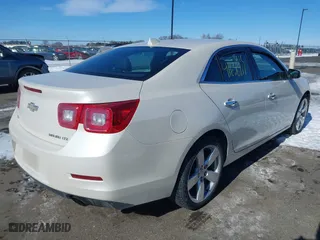 2014 Chevrolet Malibu LTZ with VIN 1G11J5SX5EF215539, listed as a IAAI auction lot 41636911 with 110,484 mi miles. Bid and sale history available at carsss.com. Image 4.