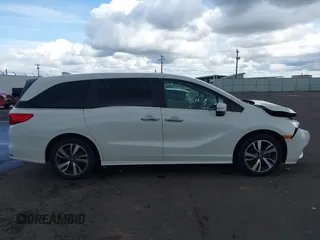 2022 Honda Odyssey Touring with VIN 5FNRL6H8XNB057293, listed as a IAAI auction lot 41826014 with 30,454 mi miles and . Bid and sale history available at DreamBid. Image 13.