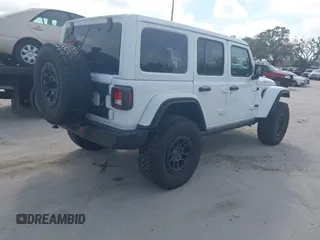 2023 Jeep Wrangler Sport S z VIN 1C4HJXDG5PW675463, wystawiony jako IAAI lot #41464572 z przebiegiem 3 379 mil mil oraz . Historia ofert i sprzedaży dostępna na DreamBid. Obrazek 4.
